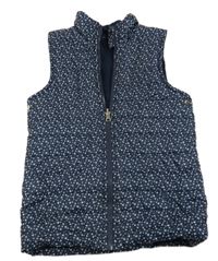 Tmavomodrá šusťáková prošívaná zateplená vesta s hvězdičkami