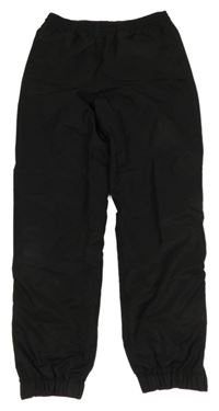 Černé šusťákové sportovní kalhoty Lacoste