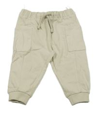 Světlebéžové tepláky s kapsami C&A