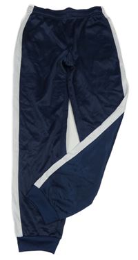 Tmavomodré sportovní tepláky s bílým pruhem 