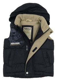 Tmavomodrá šusťáková zateplená vesta s logem a kapucí Timberland