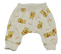 Světlebéžové melírované turecké tepláky s Pú H&M