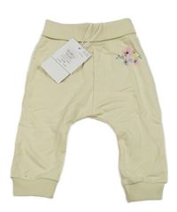 Nové - smetanové turecké tepláky s kytičkami name it.