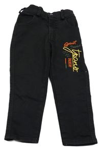 Černé skinny rifle s nápisem 