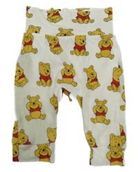 Smetanové tepláky s medvídkem Pú H&M