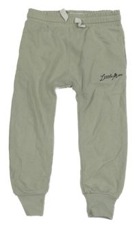 Světlezelené tepláky s nápisem Next