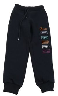 Tmavomodré silnější tepláky s nápisem 