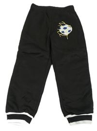 Černé tepláky s míčem 