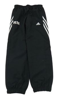 Černé šusťákové kalhoty s pruhy Addias 