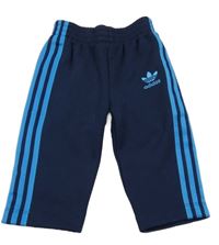 Tmavomodré tepláky s pruhy a logem - Adidas