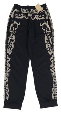 Nové - Tmavomodro-béžové vzorované tepláky 