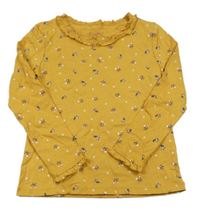 Hořčicové triko s kytičkami a volánky C&A