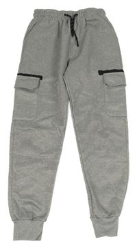 Světlešedé thermo tepláky s kapsami 