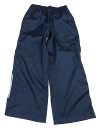 Tmavomodré šusťákové nepromokavé kalhoty Crivit