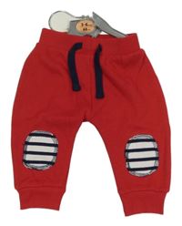 Nové - Červené tepláky s nákoleníky Early Days