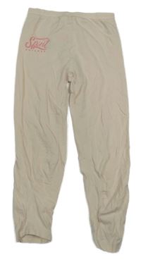 Světlebéžové legíny s nápisem 