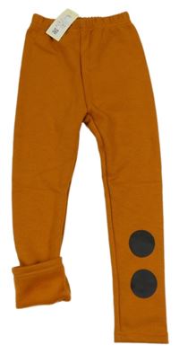 Nové - Oranžové zateplené legíny s puntíky 