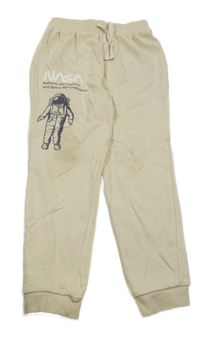 Béžové tepláky s astronautem - NASA