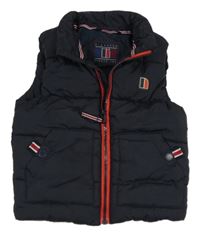 Tmavomodrá šusťáková prošívaná zateplená vesta s nášivkou Next 