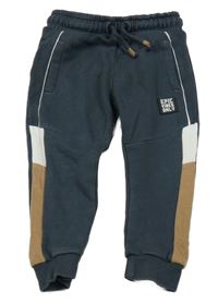 Tmavošedo-bílo-hnědé tepláky s nášivkou Nutmeg