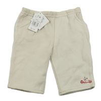 Nové - béžové tepláky s pejskem a autíčkem early days