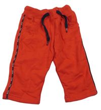 Červené tepláky s pruhem s logy PIXEL