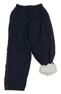 Tmavomodré šusťákové podšité kalhoty s pruhem