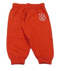 Červené lehké tepláky s nápisem 