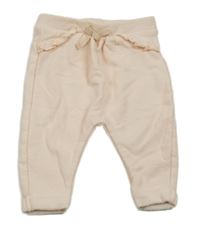 Broskvové tepláky s volánky Tape Á L´oeil