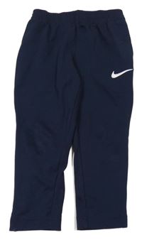Tmavomodré sportovní tepláky s logem Nike 