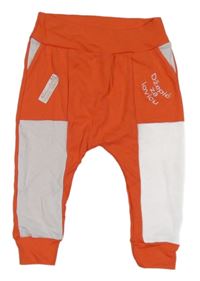 Korálovo-bílé tepláky s nápisy 