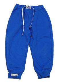 Modré tepláky s nášivkou 