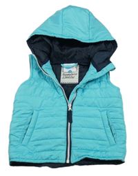 Azurová prošívaná šusťáková zateplená vesta s kapucí Topomini