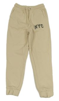 Béžové tepláky s nápisem Matalan