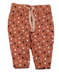 Cihlové puntíkaté tepláky Lupilu