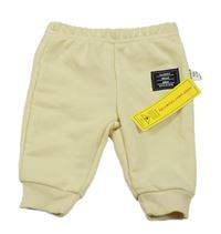 Nové - Béžové tepláky s nášivkou Shein