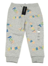 Nové - šedé tepláky s barevnými nápisy dunnes 