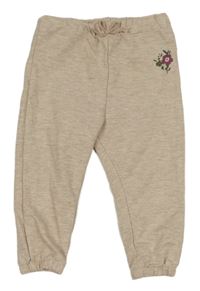 Béžovorůžové melírované tepláky s kytičkami LC Waikiki