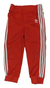 Červené sportovní tepláky s logem Adidas