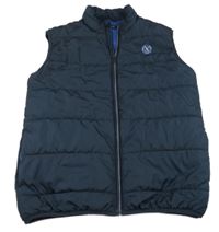 Tmavomodrá šusťáková zateplená vesta Name it