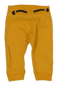 Hořčicové tepláky s medvědem Dopodopo