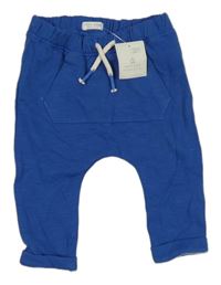 Nové - Modré tepláky Next 