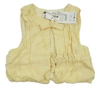 Nové - Vanilková plátěná crop zateplená vesta Zara