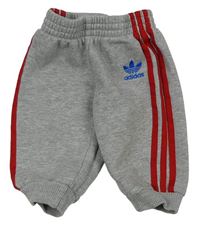 Šedé tepláky s pruhy Adidas