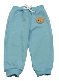 Modré tepláky s medvědem