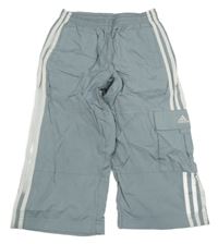 Šedé šusťákové crop kalhoty s pruhy a logem Adidas