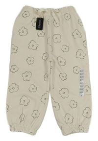 Nové - smetanové květované tepláky dunnes