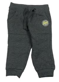 Tmavošedé melírované tepláky s nášivkou POCOPIANO