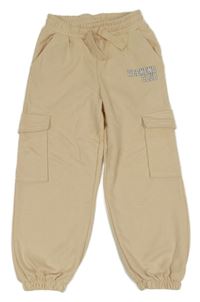 Světlebéžové tepláky s nápisem a kapsami dunnes