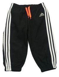 Černé šusťákové podšité kalhoty s pruhy a logem Adidas